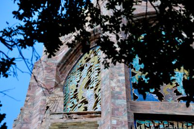 Tile work at the top of Bok Tower, Florida, seen through the leaves of the oak trees that are planted all over the grounds of the sanctuary.